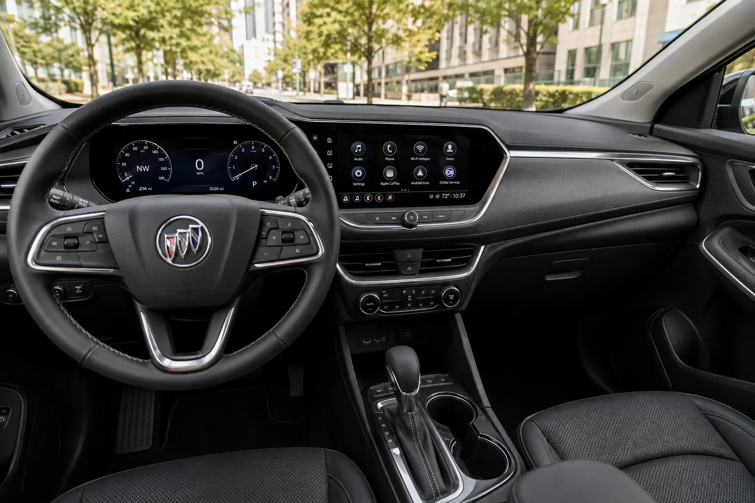 The Virtual Cockpit dashboard and touchscreen of a Buick Encore GX, lit by natural daylight.