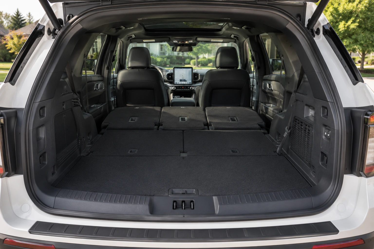 The Explorer's spacious cargo area with the third row folded, shown in natural daylight.
