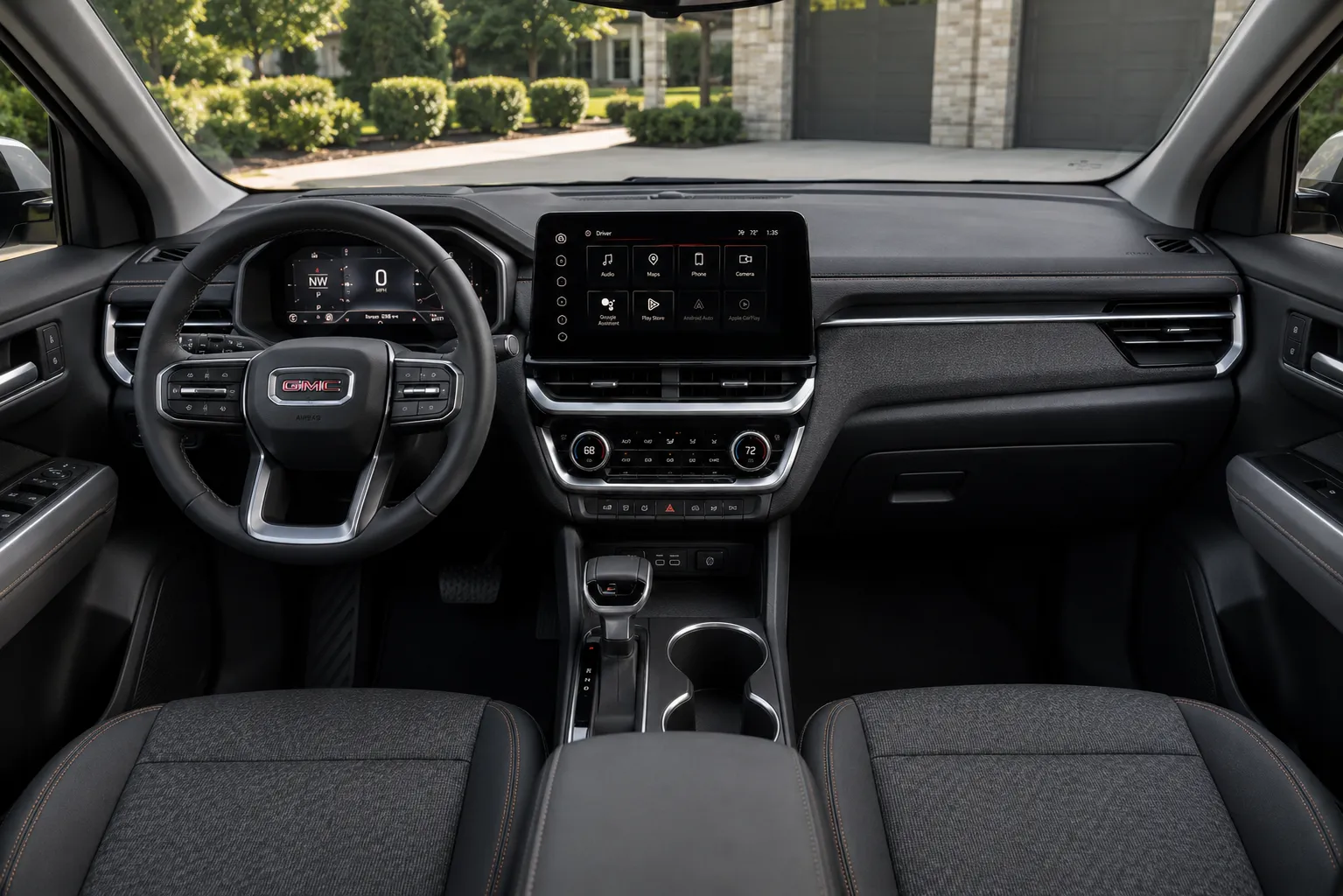 The dashboard and touchscreen of a GMC Terrain, lit by natural daylight.