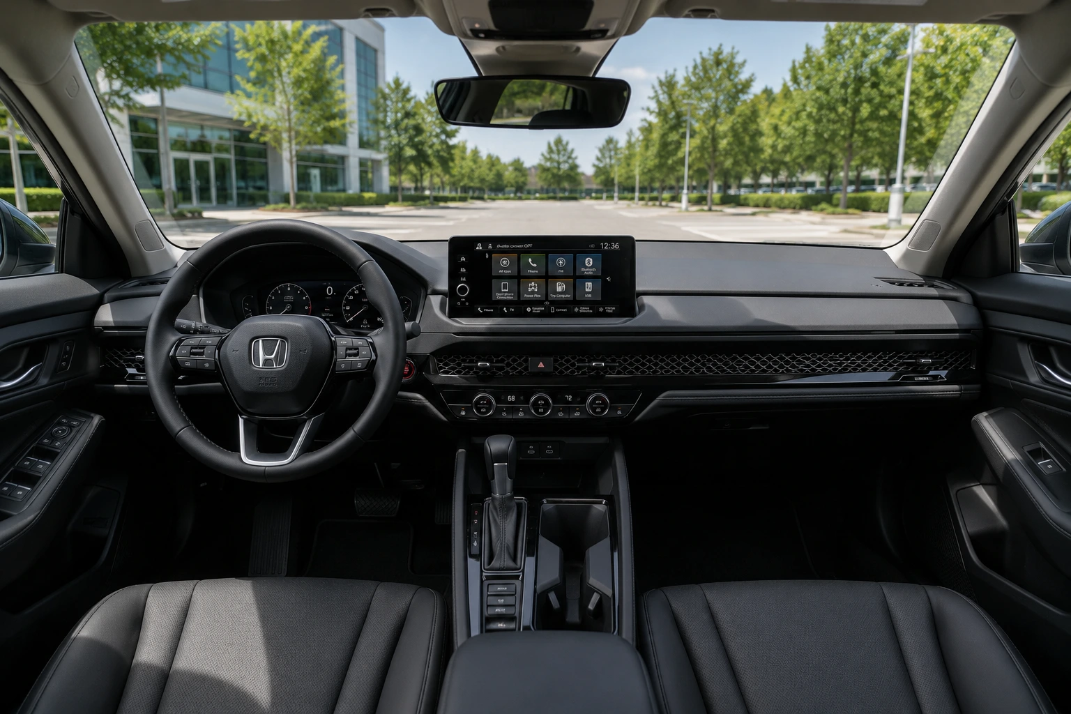 The Accord's front cabin and dashboard shown in natural daylight through the windshield.