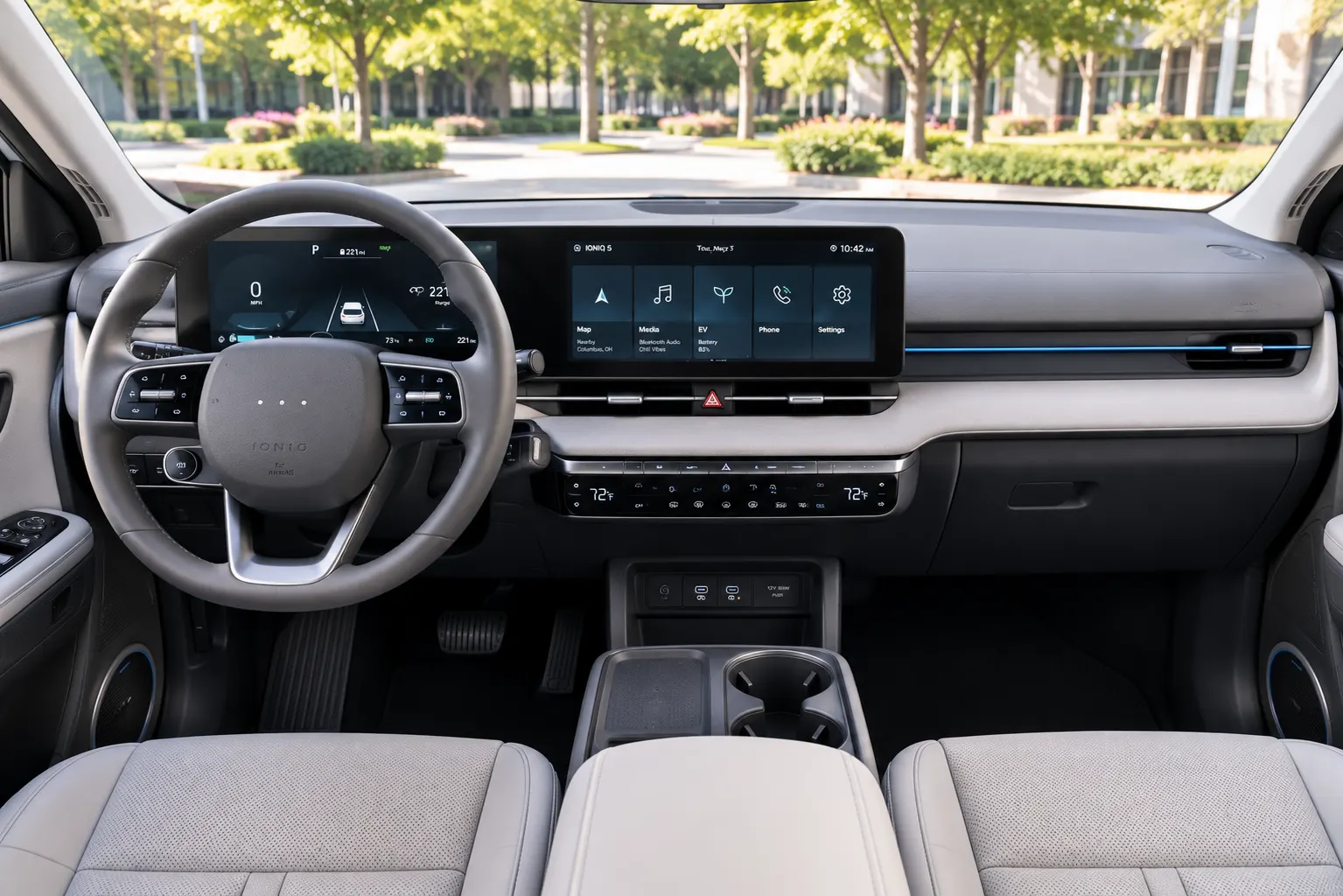 The minimalist dual-screen dashboard of a Hyundai Ioniq 5, lit by natural daylight.