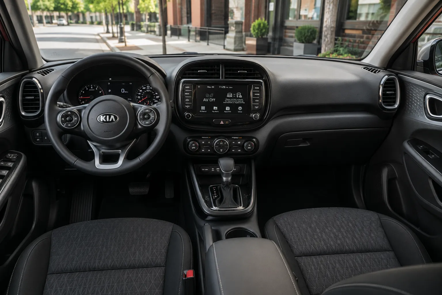 The upright, spacious interior of a Kia Soul, lit by natural daylight.