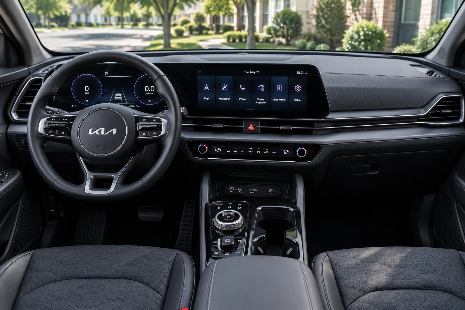 The dual 12.3-inch screens and dashboard of a Kia Sportage, lit by natural daylight.