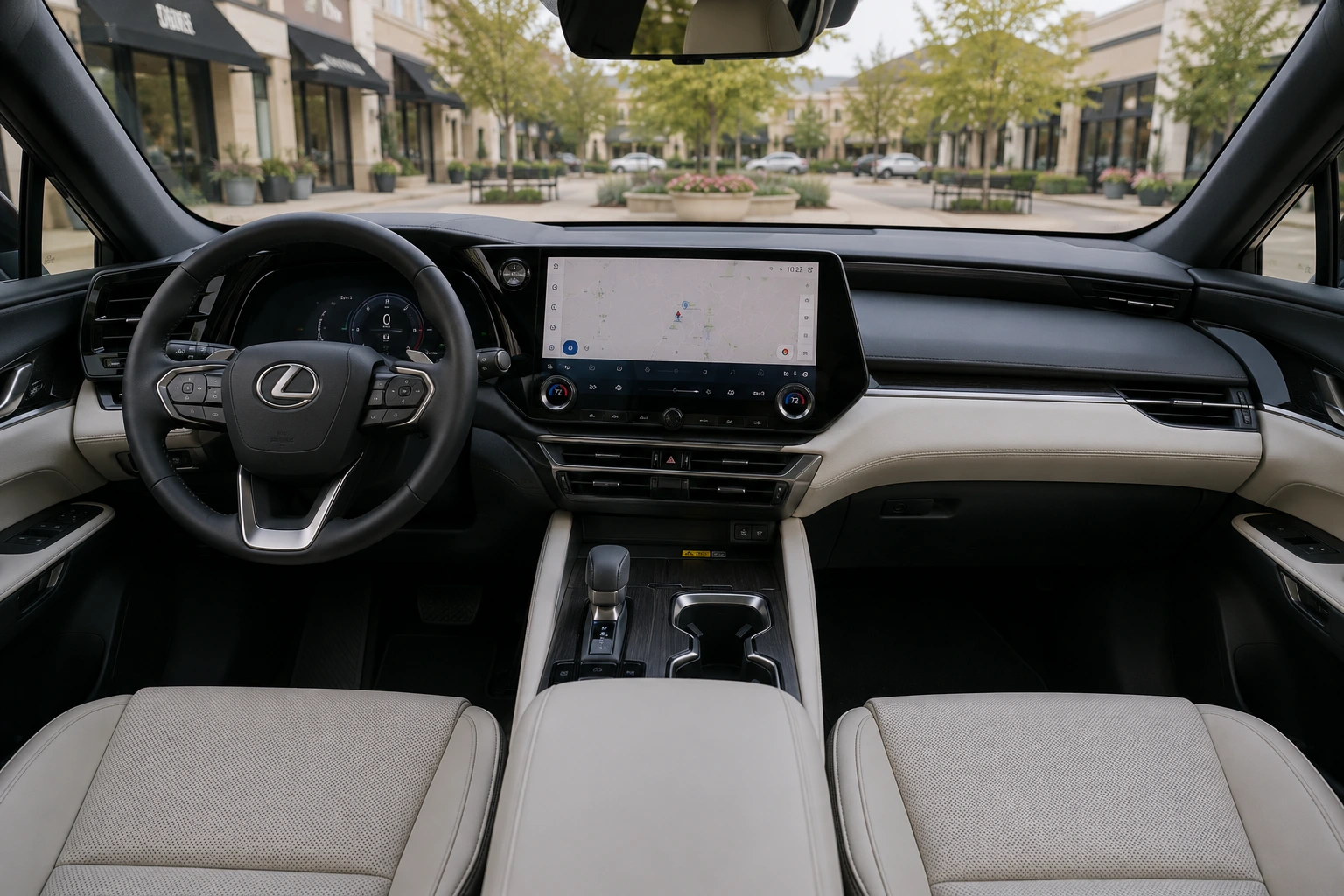 The Lexus RX's upscale dashboard and center touchscreen shown in natural daylight through the windshield.