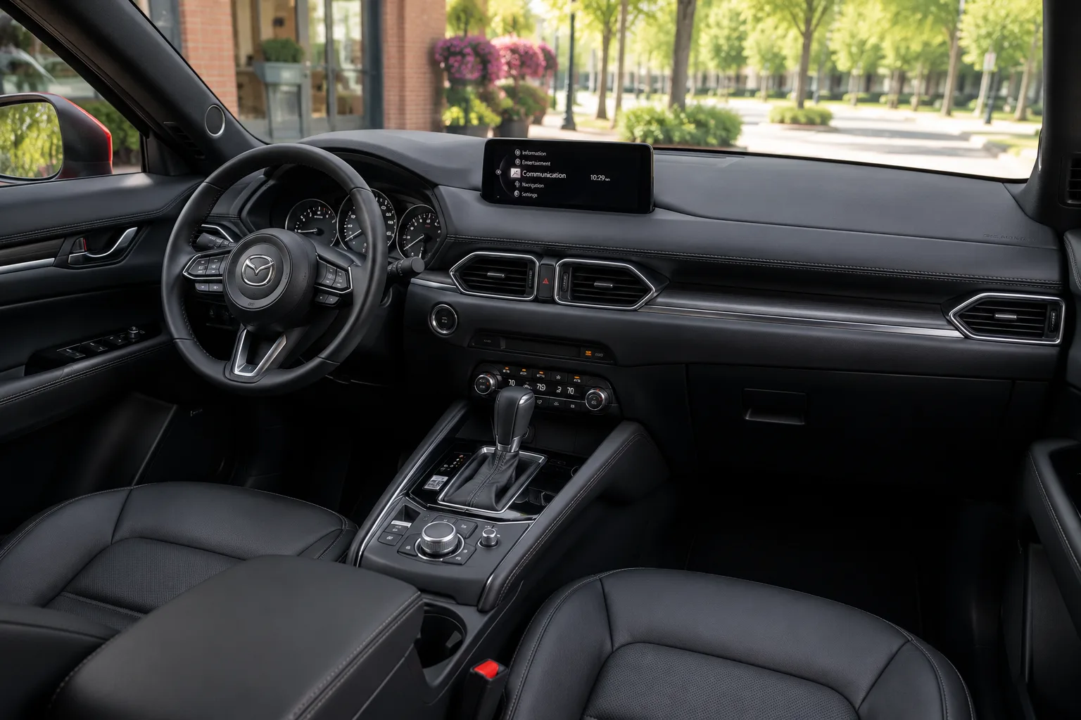 The CX-5's upscale-styled interior dashboard shown in natural daylight.