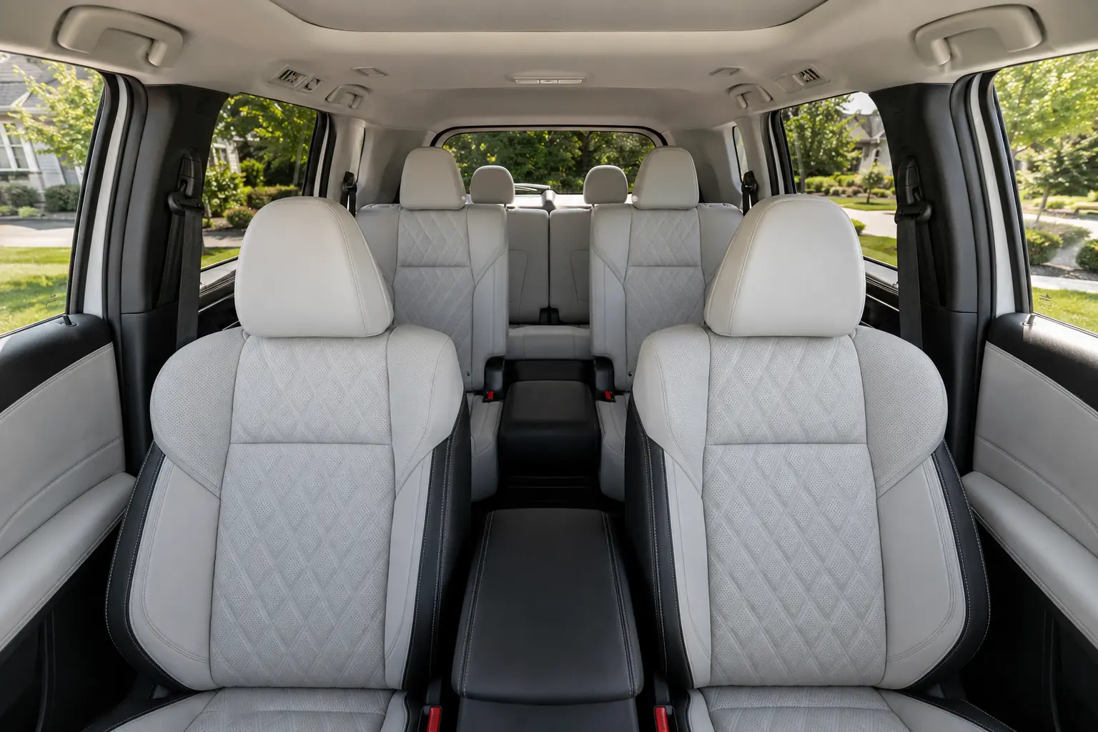 The three-row interior of a Mitsubishi Outlander, lit by natural daylight.
