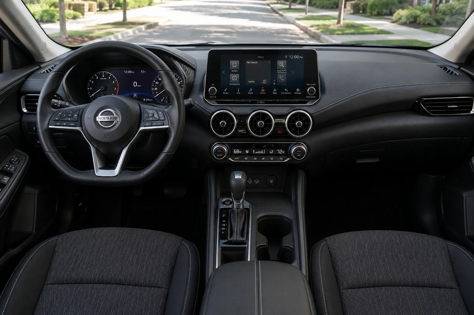 The dual 12.3-inch displays and dashboard of a Nissan Sentra, lit by natural daylight.