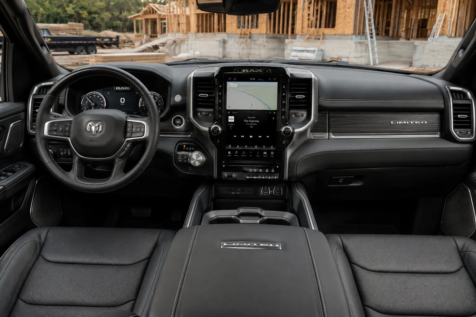 The dashboard and portrait touchscreen of a Ram 1500, lit by natural daylight.