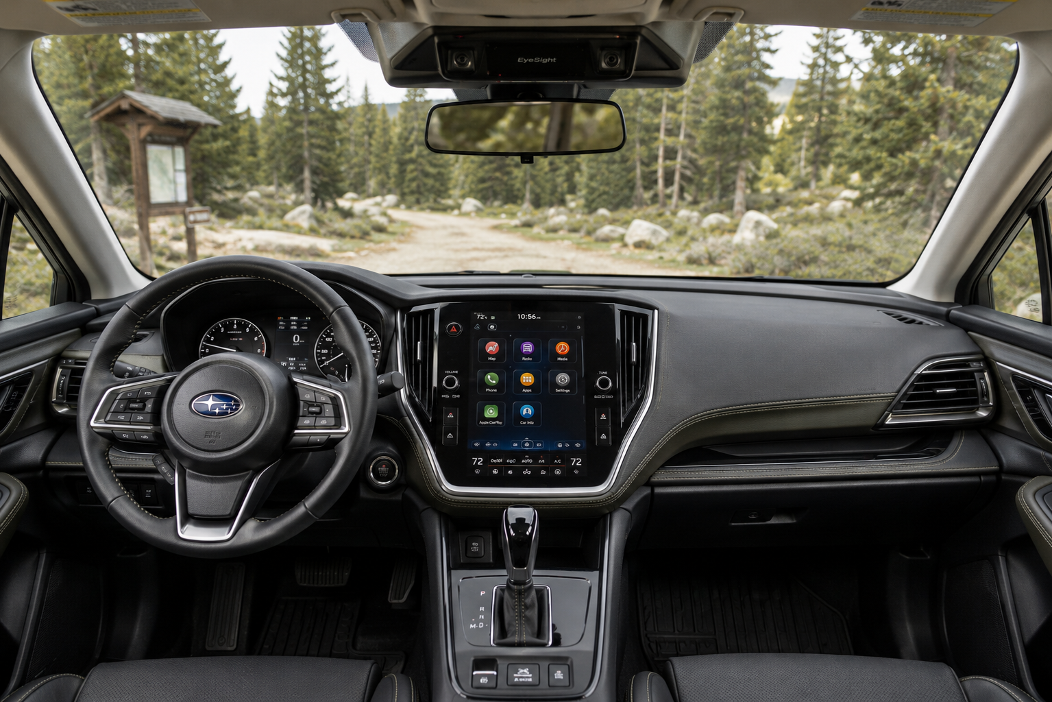 The dashboard and EyeSight camera housing of a Subaru Outback, lit by natural daylight through the windshield.